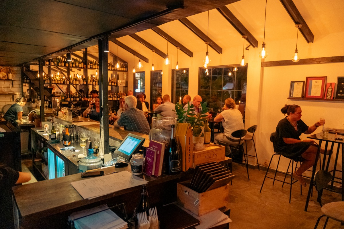 MAD WINE BAR & EATERY <br> Where Wine Speaks Softly